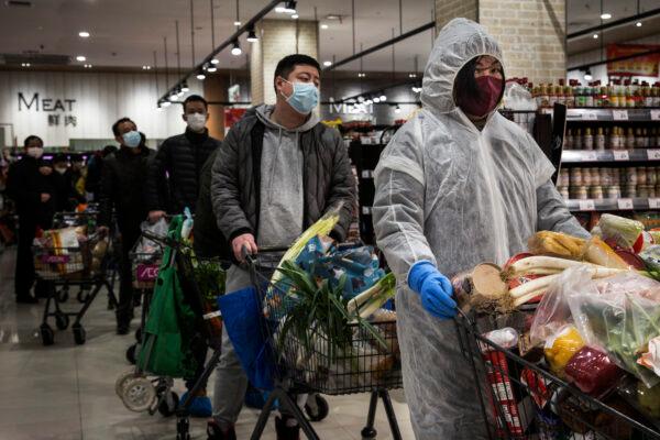 Residents line up in the supermarket in Wuhan, China, on Feb. 12, 2020. (Stringer/Getty Images)
