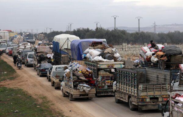 A general view of vehicles carrying belongings of internally displaced Syrians from western Aleppo countryside, in Hazano near Idlib, Syria, on Feb. 11, 2020. (Khalil Ashawi/Reuters)