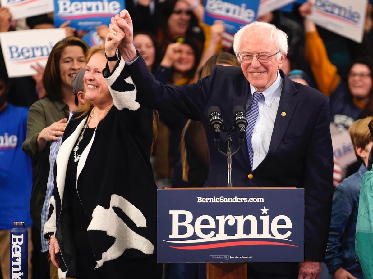 Democratic U.S. presidential candidate Senator Bernie Sanders is accompanied by his wife Jane O’Meara Sanders as he arrives to speak at his New Hampshire primary night rally in Manchester, N.H., on Feb. 11, 2020. (Rick Wilking/Reuters)