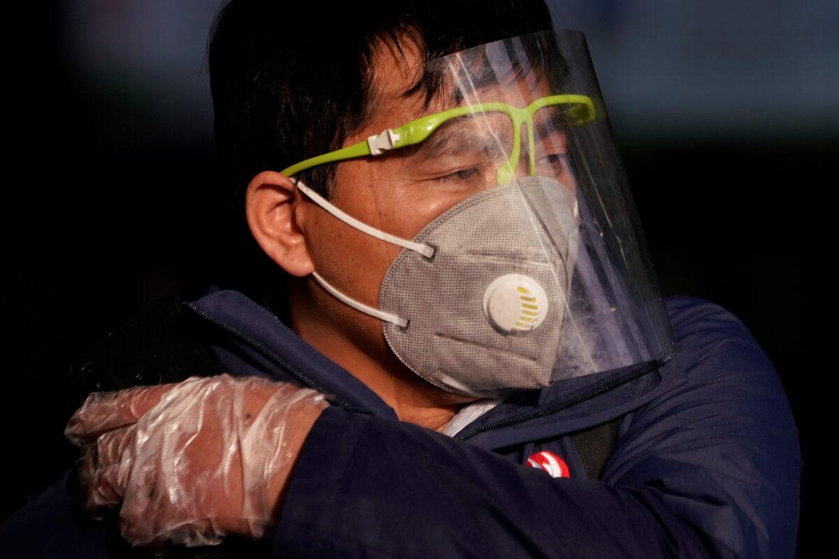 A man wearing a mask is seen at the Shanghai railway station in Shanghai, China, as the country is hit by an outbreak of the novel coronavirus on Feb. 12, 2020. (Aly Song/Reuters)