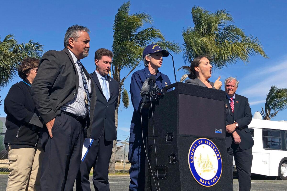 Dr. Nancy Knight, center, of the U.S. Centers for Disease Control and Prevention talks to reporters at March Air Reserve Base in Riverside, Calif. on Feb. 11, 2020, along with other officials including Dr. Christopher Braden. (Amy Taxin/AP Photo)