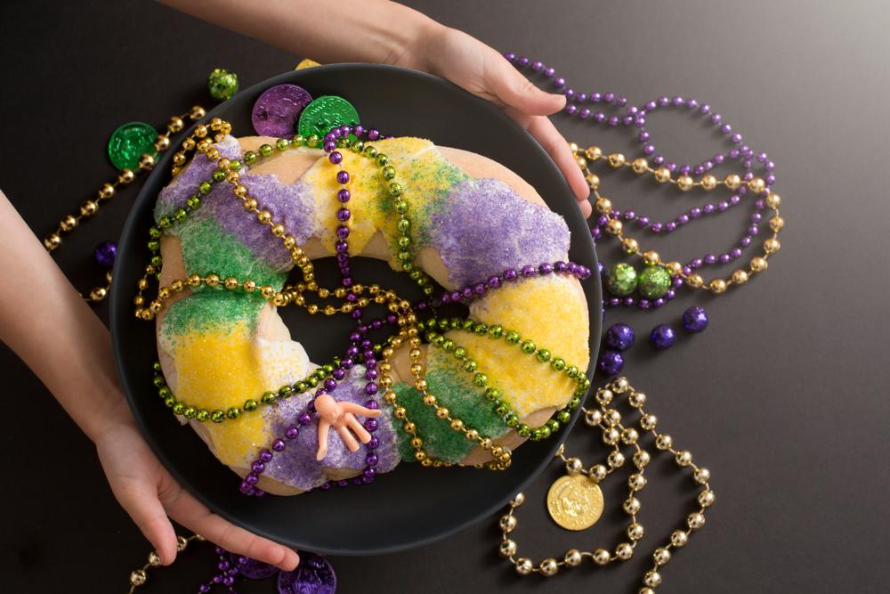 King cakes come decked out in the colors of Mardi Gras: purple for justice, green for faith, and gold for power. (Shutterstock)