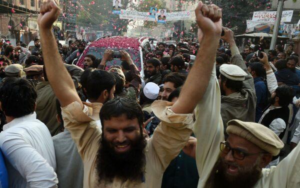 Pakistani supporters of the Jamaat-ud-Dawa (JuD) organization celebrate after the release of their leader Hafiz Saeed ordered by a court in Lahore, Pakistan, on Nov. 22, 2017. (Arif Ali/AFP via Getty Images)