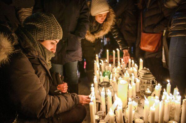 Members of Montreal's Iranian community attend a vigil to mourn victims of the Iranian air crash in downtown Montreal, Canada , on Jan. 9, 2020. (The Canadian Press/Andrej Ivanov)