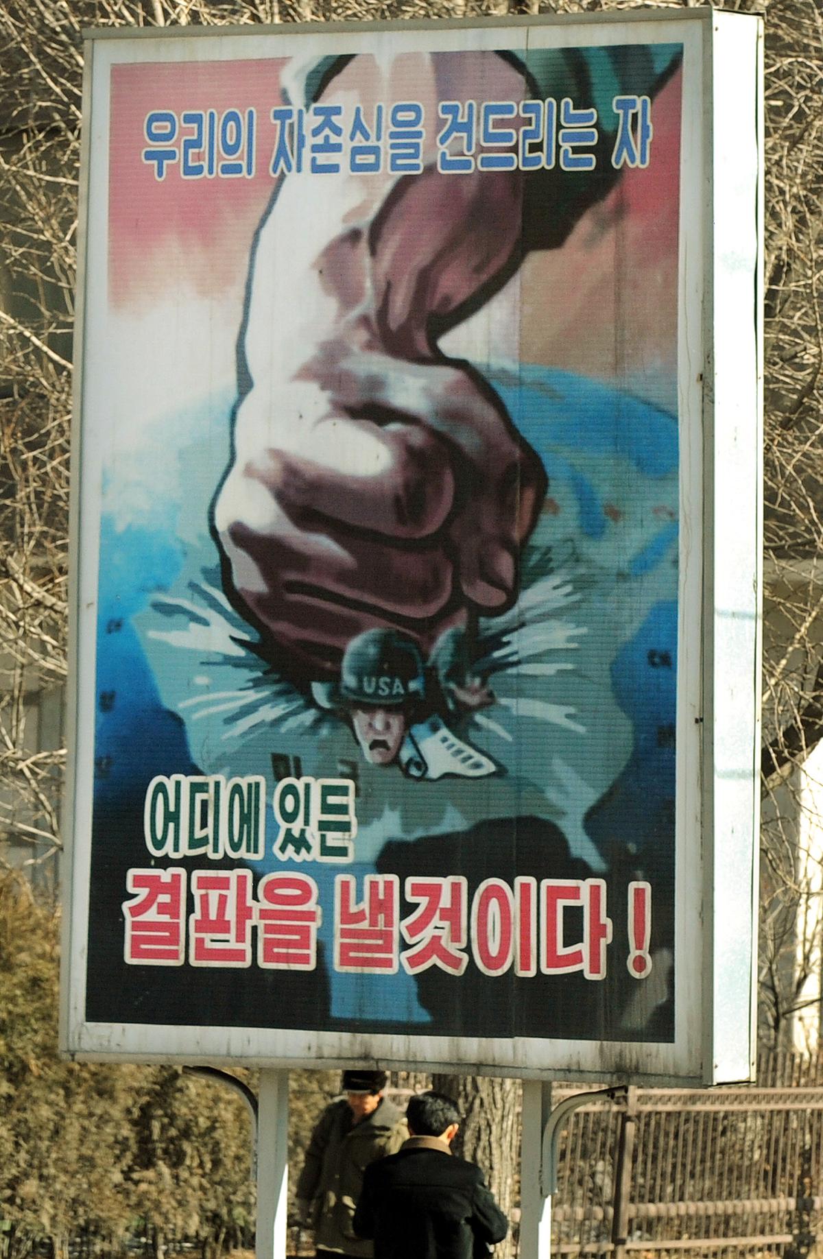 An anti-U.S. propaganda poster showing a fist crushing a U.S. soldier on a display on the streets of the North Korean capital Pyongyang, on Feb. 27, 2008. (Mark Ralston/AFP via Getty Images)