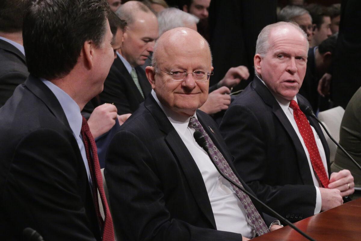 (L–R) FBI Director James Comey, Director of National Intelligence James Clapper, and CIA Director John Brennan prepare to testify before the House Permanent Select Committee on Intelligence on Feb. 25, 2016. (Chip Somodevilla/Getty Images)