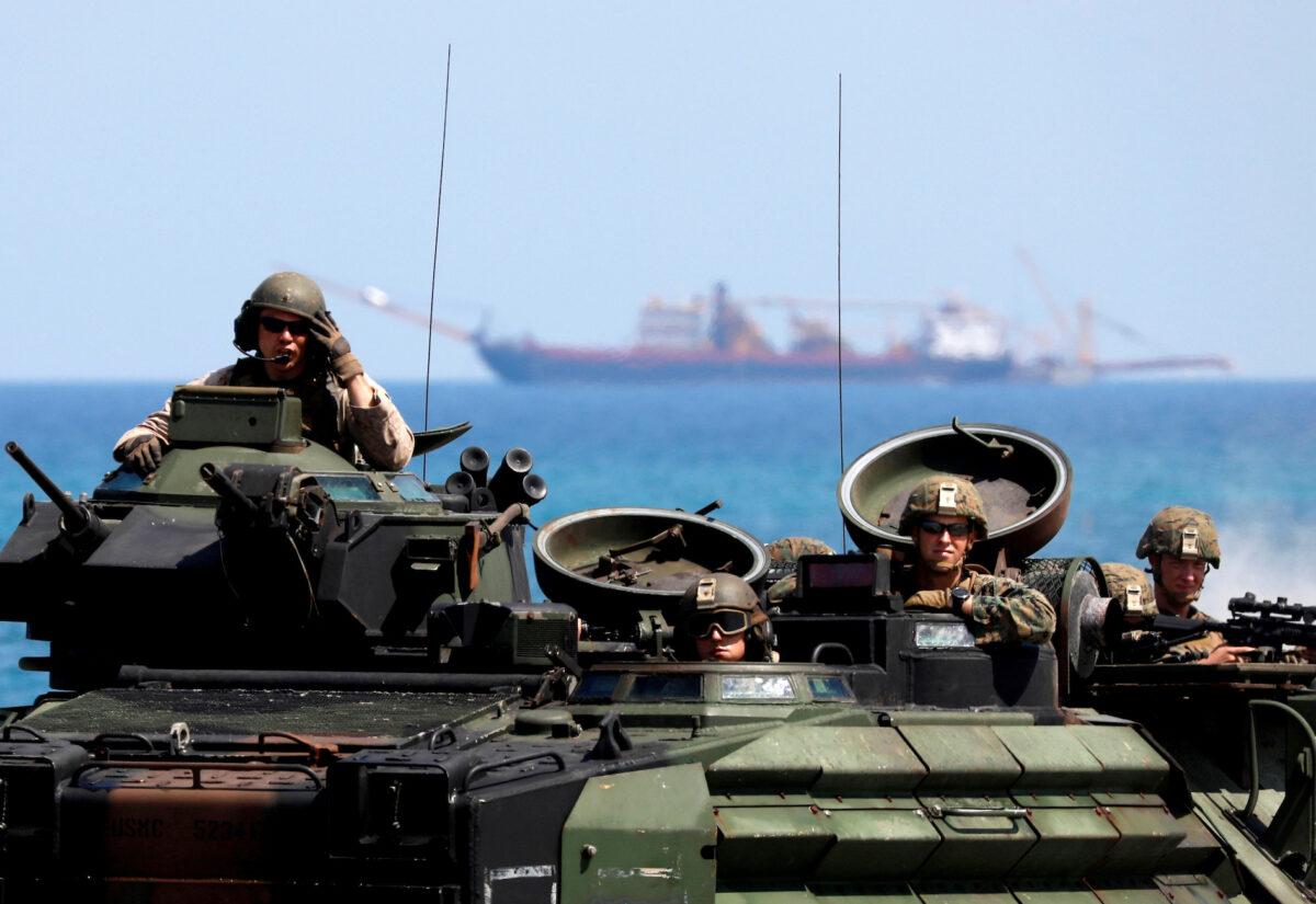 U.S. Marines arrive in an amphibious assault vehicle during the amphibious landing exercises of the U.S.-Philippines war games promoting bilateral ties at a military camp in Zambales Province, Philippines, on April 11, 2019. (Eloisa Lopez/Reuters)