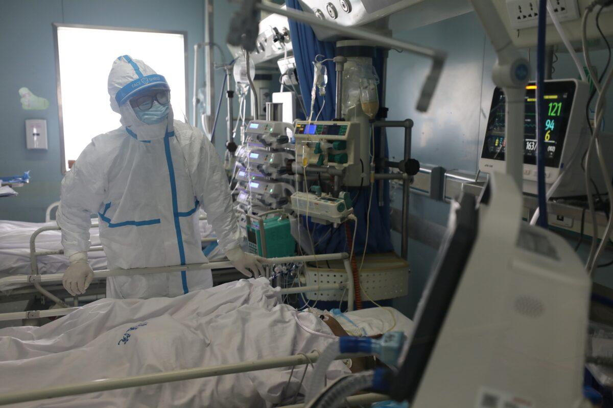 A medical worker works at the intensive care unit of Jinyintan hospital in Wuhan, the epicenter of the novel coronavirus outbreak, in Hubei Province, China on Feb. 13, 2020. (China Daily via Reuters)