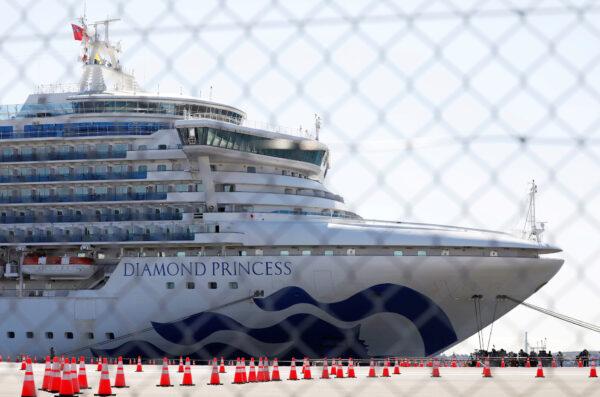 The cruise ship Diamond Princess, where dozens of passengers were tested positive for coronavirus, is seen through steel fence at Daikoku Pier Cruise Terminal in Yokohama in Japan on Feb. 11, 2020. (Issei Kato/File Photo/Reuters)
