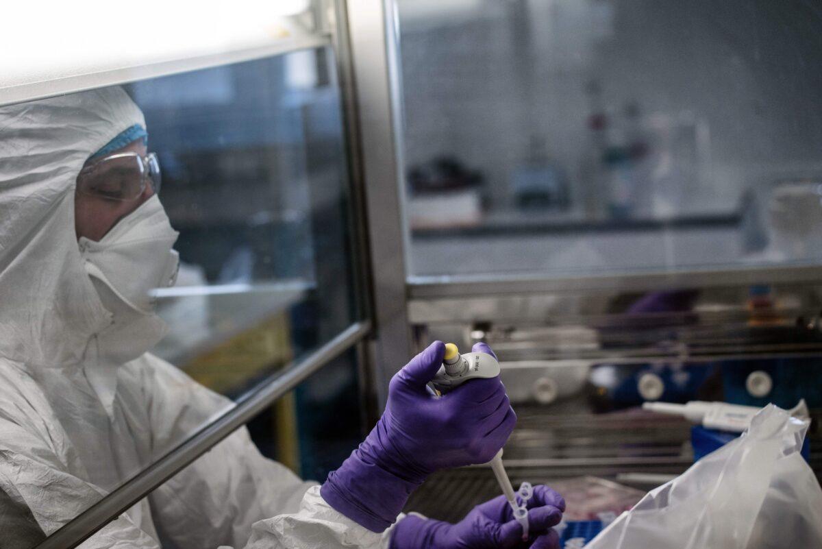 A scientist is at work in the VirPath university laboratory, classified as "P3" level of safety, as they try to find a treatment against COVID-19, in France on Feb. 5, 2020. France reported the first death from the virus in Europe on Feb. 15, 2020. (Jeff Pachoud/AFP via Getty Images)