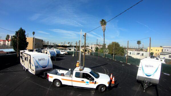 Trucks deliver trailers for the homeless in Los Angeles on Feb. 13, 2020. (Courtesy of Gov. Gavin Newsom's Office)