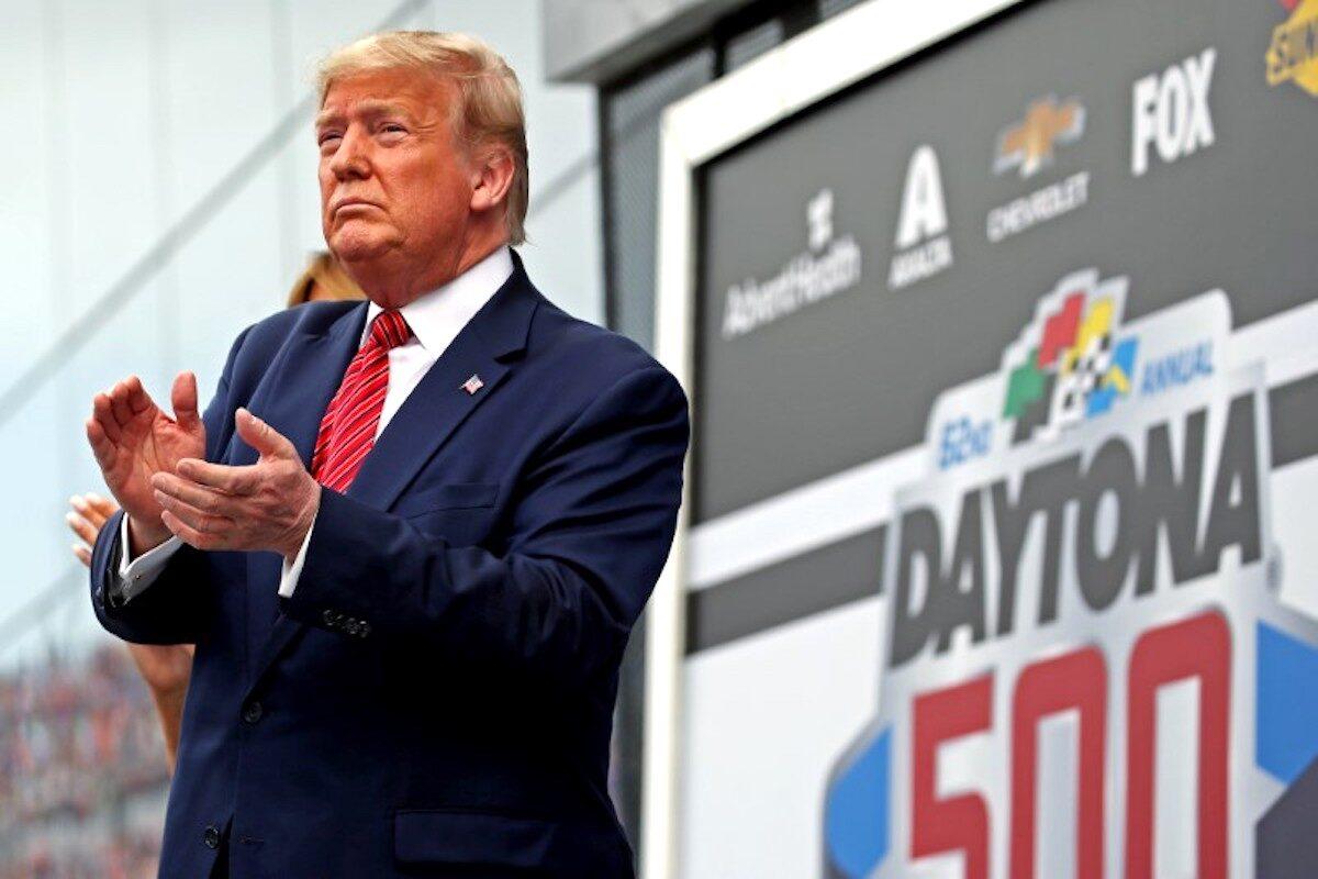 President Donald Trump with First Lady Melania Trump speaks before the Daytona 500 at Daytona International Speedway in Daytona Beach, Fla., on Feb 16, 2020. (Peter Casey/USA TODAY Sports via Reuters)