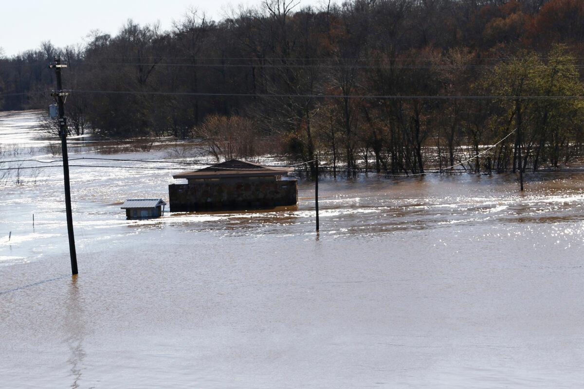 The restrooms on the Madison County side of the Ross Barnett Reservoir Spillway Park are about the only structure still visible as floodwaters have covered both sides of the popular fishing and boat landing in central Mississippi, on Feb. 14, 2020. (Rogelio V. Solis/AP Photo)