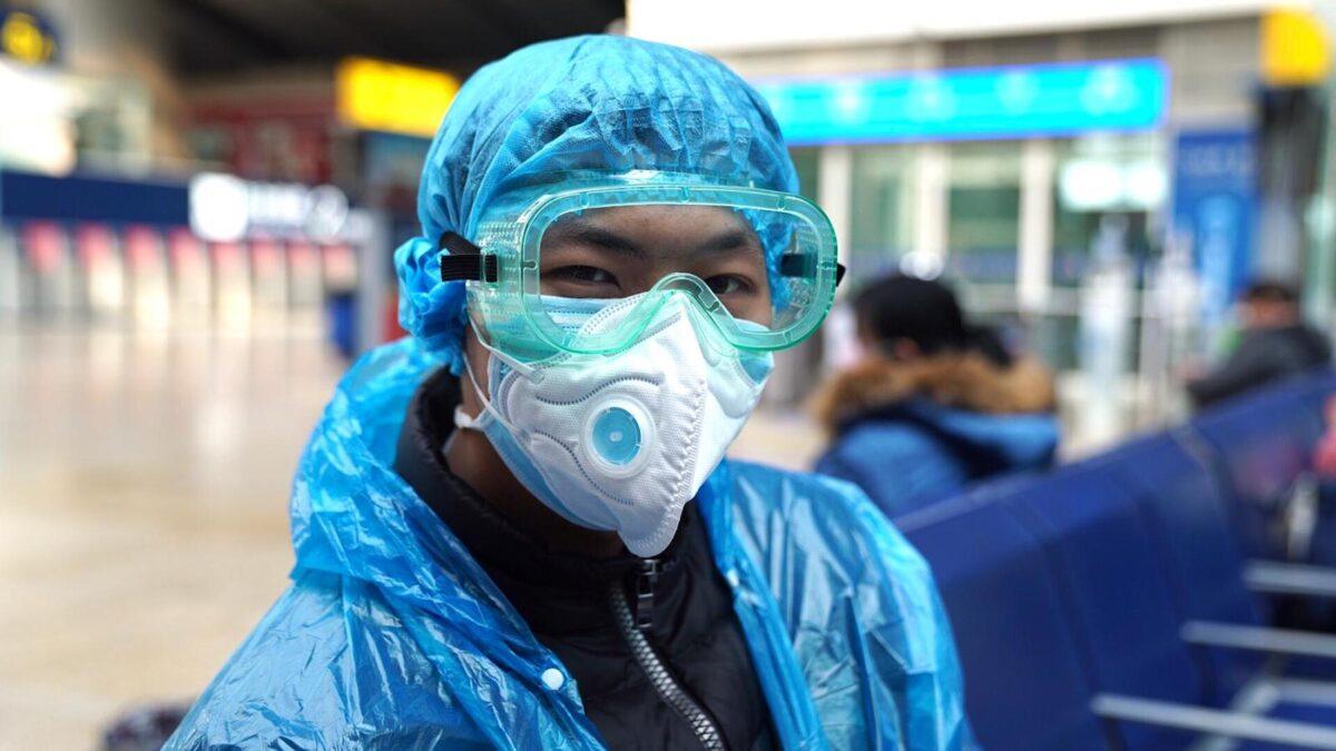 A traveler in Beijing's South Railway Station on Feb. 15, 2020. (Natalie Thomas/CNN)