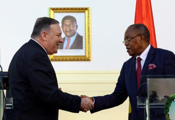 U.S. Secretary of State Mike Pompeo and Angolan Foreign Minister Manuel Domingos Augusto shake hands after a news conference the at Ministry of Foreign Affairs in Luanda, Angola, on Feb. 17, 2020. (Andrew Caballero-Reynolds/Pool via Reuters)
