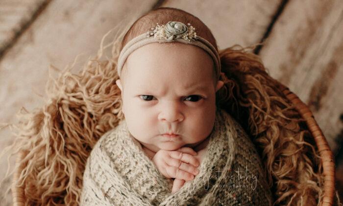 Baby’s Grouchy Facial Expressions During Photoshoot Take Over the Internet, and Her Parents Love It