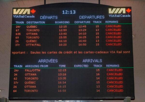 Cancelled rail arrivals and departures are listed on the board at Central Station in Montreal, Canada, on Feb. 14, 2020. (Ryan Remiorz/TheCanadianPress)