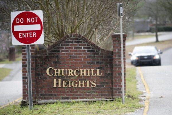 A police officer blocks a road near an entrance to the Churchill Heights neighborhood on Feb. 13, 2020, in Cayce, S.C., where 6-year-old Faye Marie Swetlik recently went missing just after getting off a school bus. (Sean Rayford/AP Photo)