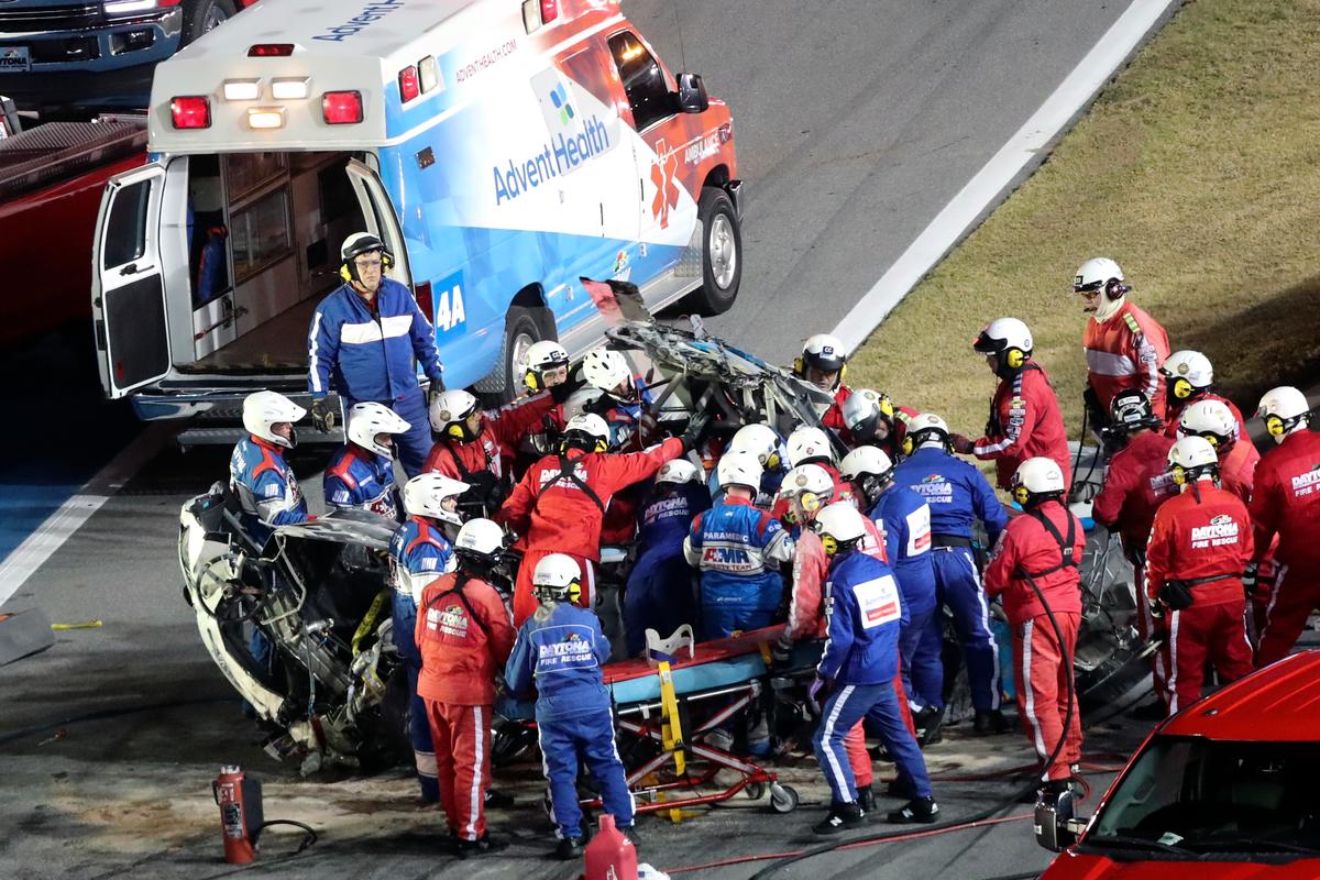 Rescue workers remove Ryan Newman from his car after he was involved in a wreck on the last lap of the NASCAR Daytona 500 auto race at Daytona International Speedway, in Daytona Beach, Fla., on Feb. 17, 2020. (David Graham/AP Photo)