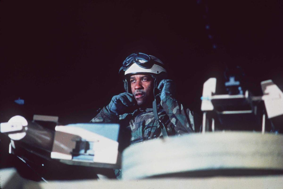 Washington in his role as Lieutenant Colonel Nathaniel Serling in "Courage Under Fire," photographed on set in June 1996 (©<a href="https://www.gettyimages.com/detail/news-photo/danzel-washington-as-a-tank-commander-in-courage-under-fire-news-photo/51098123?adppopup=true">Getty Images</a>)