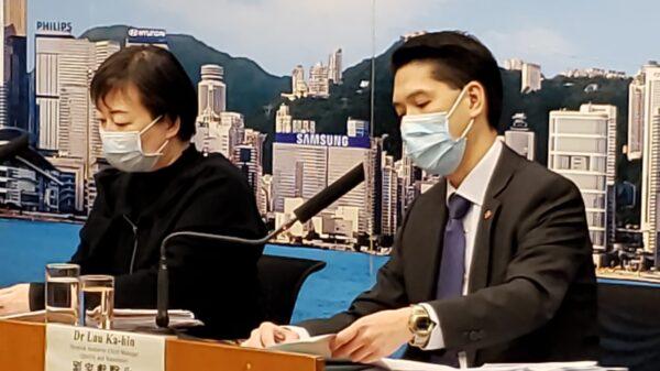 Chuang Shuk-kwan (L), head of the Communicable Disease Branch of the Center for Health Protection, and Lau Ka-hin, chief manager of quality and standards at Hong Kong’s Health Authority, speak at a press conference in Hong Kong on Feb. 19, 2020. (Bill Cox/The Epoch Times)