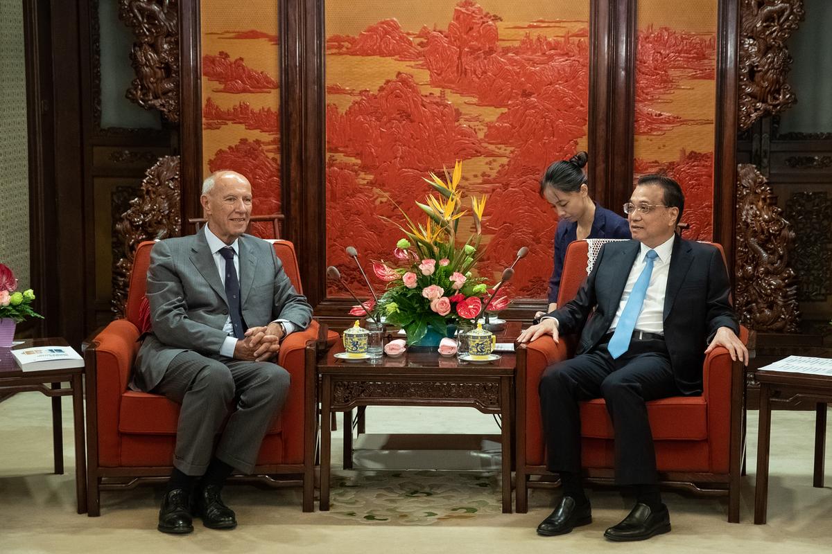 World Intellectual Property Organization director general Francis Gurry (L) talks to China's Premier Li Keqiang (R) during their meeting at the Zhongnanhai Leadership Compound in Beijing on Aug. 28, 2018. Representatives from countries involved in the 'One Belt, One Road' (OBOR or Belt and Road Initiative) are in Beijing for a high-level intellectual property conference. (Roman Pilipey/AFP via Getty Images)
