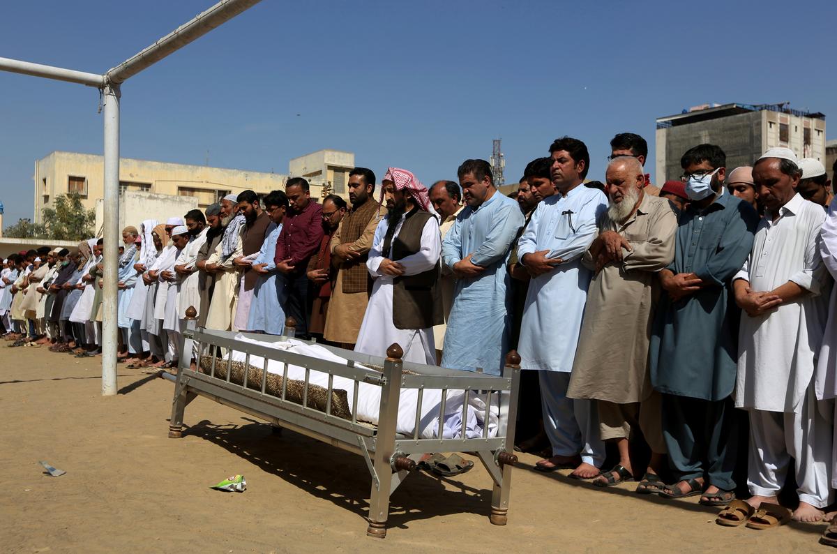 People offer funeral prayers for a victim of a toxic gas leak, during his funeral prayer, in Karachi, Pakistan, on Feb. 17, 2020. (Fareed Khan/AP Photo)