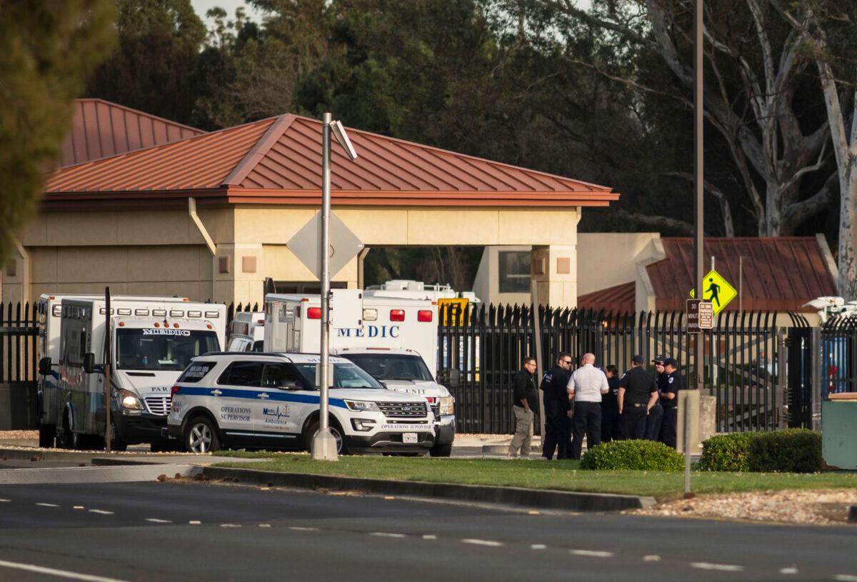 A group of ambulances from the Solano EMS Cooperative stage at the visitor center at Travis Air Force Base, adjacent to Fairfield, Calif., on Feb. 16, 2020. (Hector Amezcua/AP Photo)