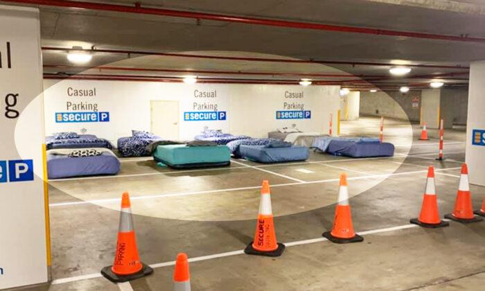 Homeless Sleep on Real Beds in Empty Parking Garage Thanks to Safe Overnight Shelter Program