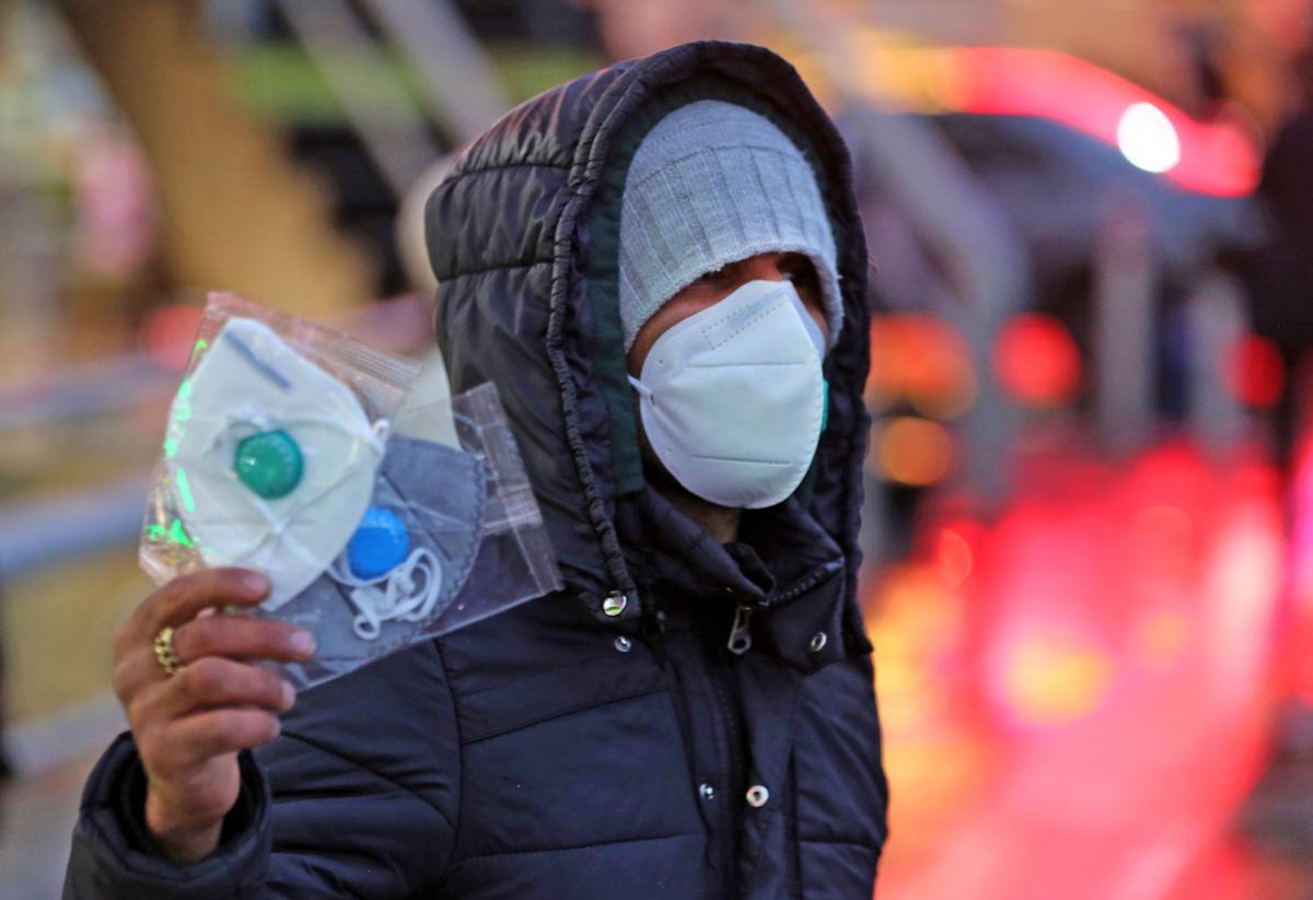 An Iranian street vendor sells protective masks in the capital Tehran on Feb. 20, 2020. (Atta Kernare/AFP via Getty Images)