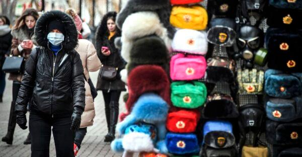 A person wearing a face mask walks along Arbat street in downtown Moscow on Feb. 19, 2020.(Alexander Nemenov/AFP via Getty Images)