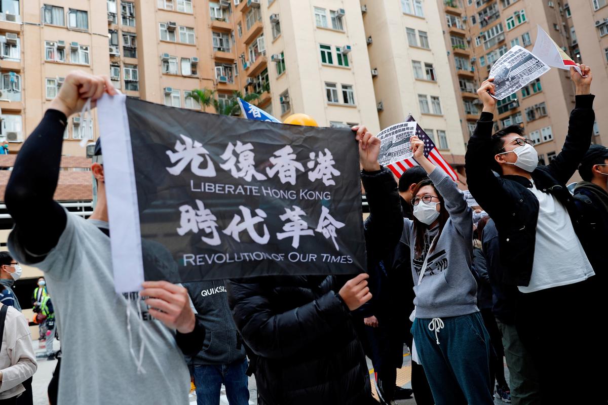 Residents wear facial masks as they march to protest against the government's plan to set up a quarantine site close to their community amid the coronavirus outbreak, in Hong Kong, China on Feb. 2, 2020. (Tyrone Siu/Reuters)