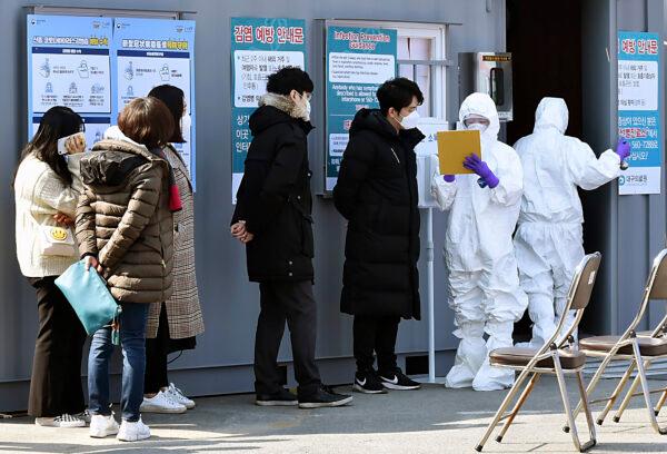 People suspected of being infected with the new coronavirus wait to receive tests at a medical center in Daegu, South Korea, on Feb. 20, 2020. (Lee Moo-ryul/Newsis via AP)