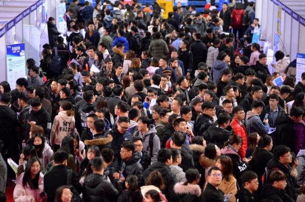Students are seen at a job fair for graduates at a university in Shenyang, Liaoning Province, China on March 21, 2019. (Reuters)