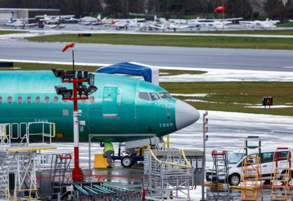 An employee works on a Boeing 737 Max aircraft at the Renton Municipal Airport in Renton, Washington, on Jan. 10, 2020. (Lindsey Wasson/Reuters)