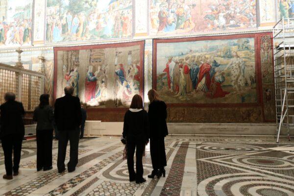 Visitors gain a sneak peek at Raphael's "Acts of the Apostles" tapestries as they are hung in the Sistine Chapel prior to being open to the public. (Governatorato SCV – Direzione dei Musei)