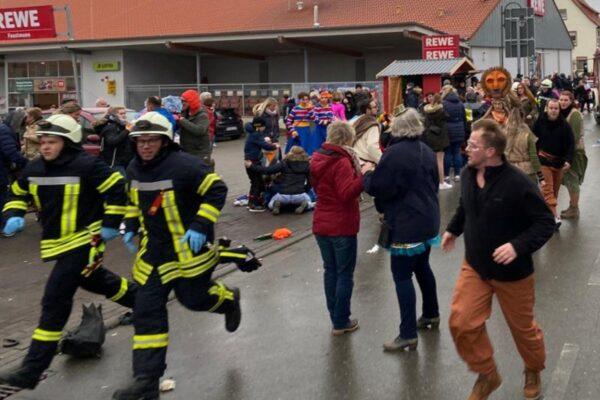 People react at the scene after a car plowed into a carnival parade injuring several people in Volkmarsen, Germany, on Feb. 24, 2020. (Elmar Schulten/Waldeckische Landeszeitung via Reuters)