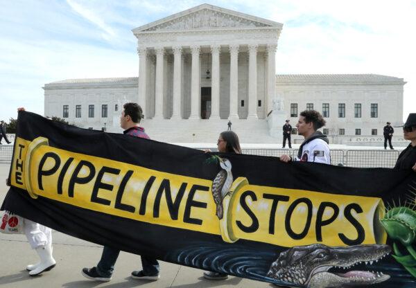 Climate activist groups protest in front of the U.S. Supreme Court as oral arguments are heard in the U.S. Forest Service and Atlantic Coast Pipeline, LLC v. Cowpasture River Assn. case, in Washington, on Feb. 24, 2020. (Mark Wilson/Getty Images)