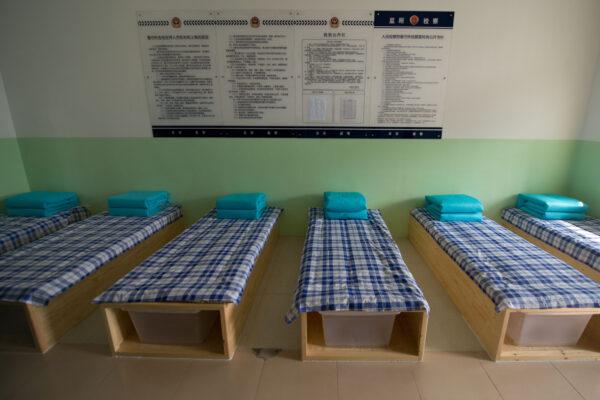 This general view shows beds at an 'Interim Room' inside the No.1 Detention Center in Beijing, China on Oct. 25, 2012. (Ed Jones/AFP via Getty Images)