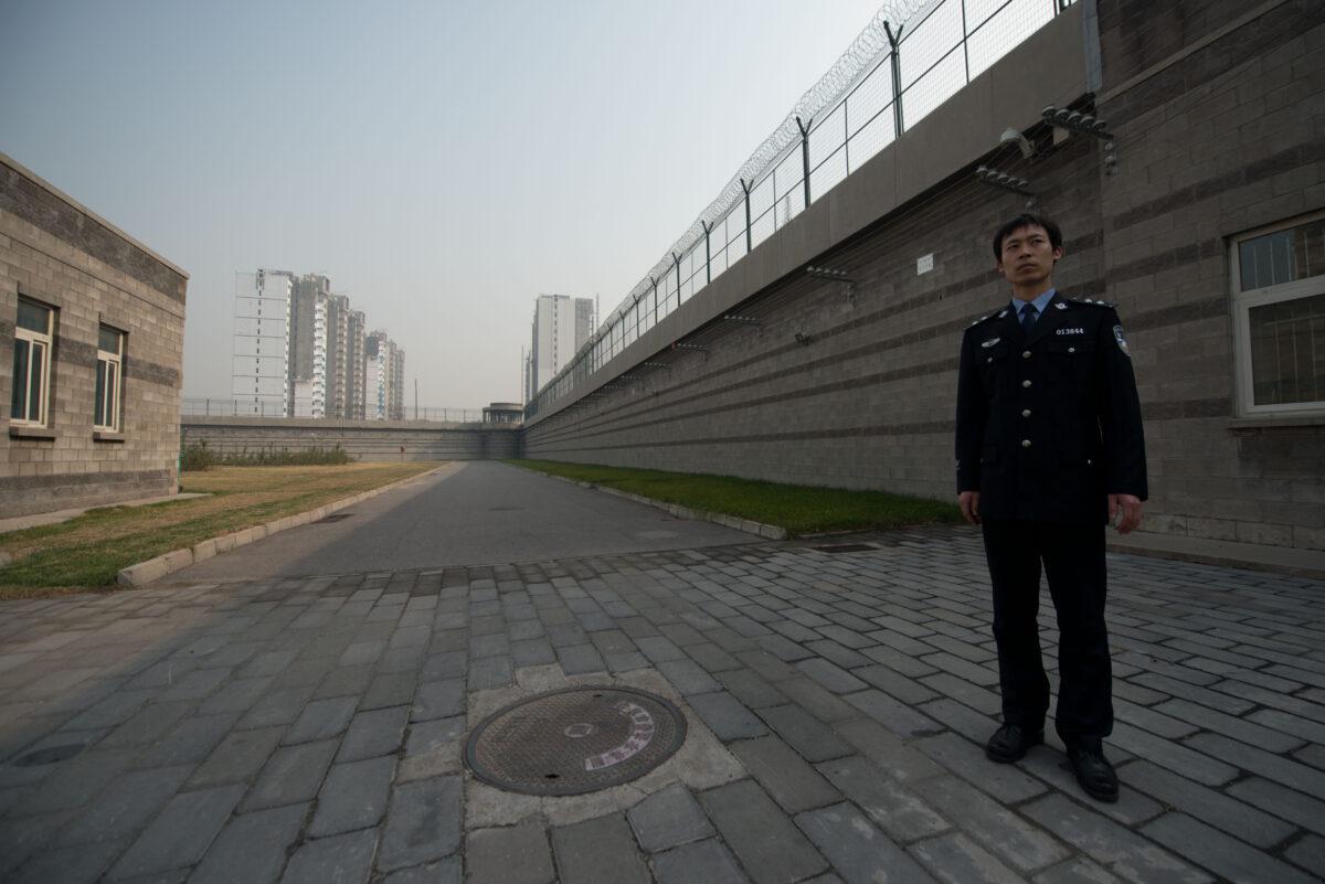 A prison guard stands in a courtyard inside the No.1 Detention Center in Beijing, on Oct. 25, 2012. (Ed Jones/AFP via Getty Images)