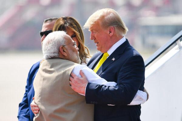 India's Prime Minister Narendra Modi (L) embraces U.S. President Donald Trump upon his arrival at Sardar Vallabhbhai Patel International Airport in Ahmedabad, India, on Feb. 24, 2020. (Mandel Ngan/AFP via Getty Images)