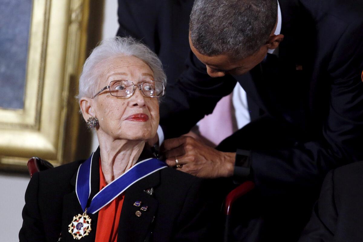 Former President Barack Obama presents the Presidential Medal of Freedom to NASA mathematician Katherine G. Johnson during an event in the East Room of the White House in Washington on Nov. 24, 2015. (Carlos Barria/Reuters)