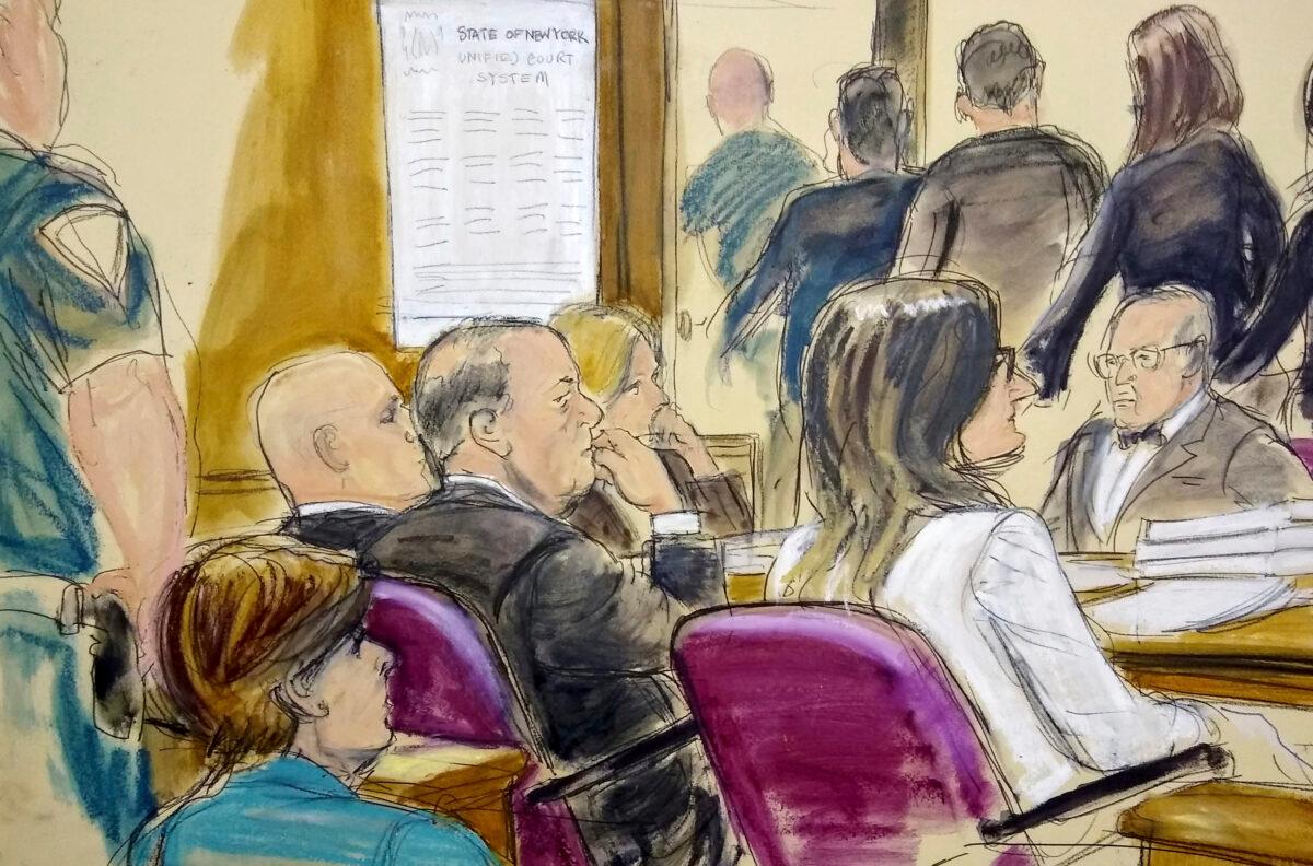 In this courtroom drawing, Harvey Weinstein (C) sits at the defense table surrounded by his attorneys as jurors file out of the courtroom after being told by the judge to go back and keep deliberating in Weinstein's rape case at Manhattan Supreme Court in New York on Feb. 21, 2020. (Elizabeth Williams via AP)