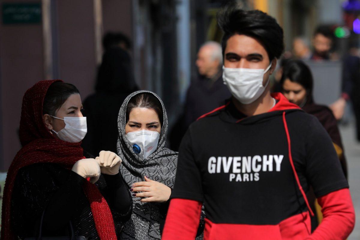 Pedestrians wear masks to help guard against the Coronavirus, in downtown Tehran, Iran, on Feb. 23, 2020. (Ebrahim Noroozi/AP Photo)