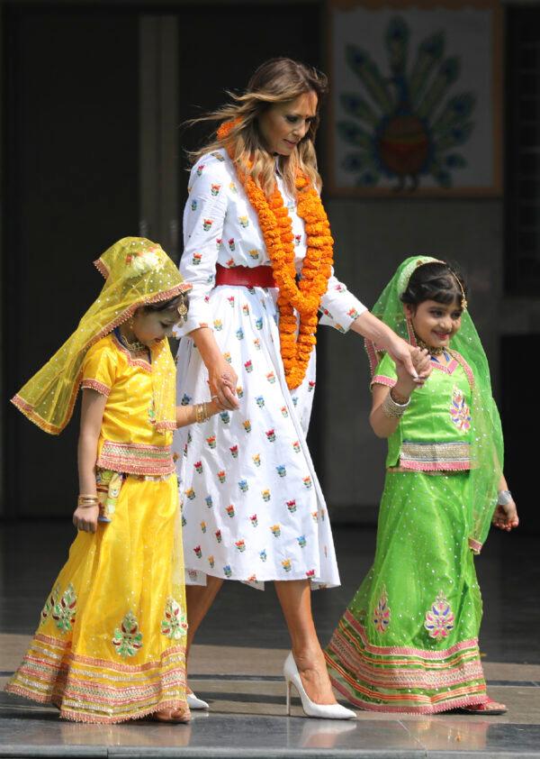 U.S. First Lady Melania Trump walks with two children at Sarvodaya Co-Educational Senior Secondary School in New Delhi, India, on Feb. 25, 2020. (Altaf Qadri/AP Photo)