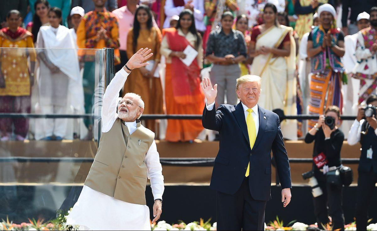 President Donald Trump (R) and India's Prime Minister Narendra Modi wave at the crowd during the 'Namaste Trump' rally at Sardar Patel Stadium in Motera, on the outskirts of Ahmedabad, India, on Feb. 24, 2020. (Money Sharma/AFP via Getty Images)