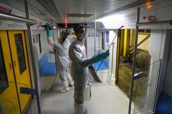 Tehran Municipality workers clean a metro train to avoid the spread of the COVID-19 illness on Feb. 26, 2020. (Atta Kenare/AFP via Getty Images)