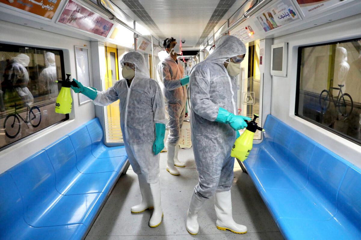 Workers disinfect subway trains against coronavirus in Tehran, Iran, in the early morning of Wednesday, Feb. 26, 2020. (Ebrahim Noroozi/AP Photo)