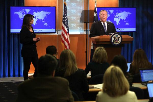 U.S. Secretary of State Mike Pompeo speaks as State Department spokesperson Morgan Ortagus listens during a news briefing at the State Department in Washington on Feb. 25, 2020. (Alex Wong/Getty Images)