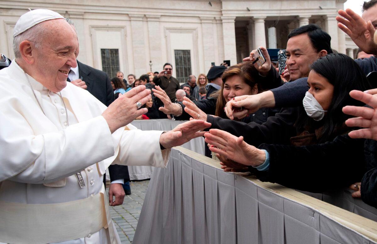 Pope Francis greets catholic faithfuls at St Peter's square in the Vatican at the end of his weekly general audience on February 26, 2020. (TIZIANA FABI/AFP via Getty Images)
